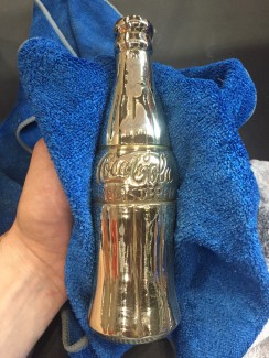 polished brass coke bottle