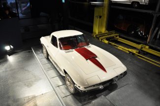 classic white and red car in shop