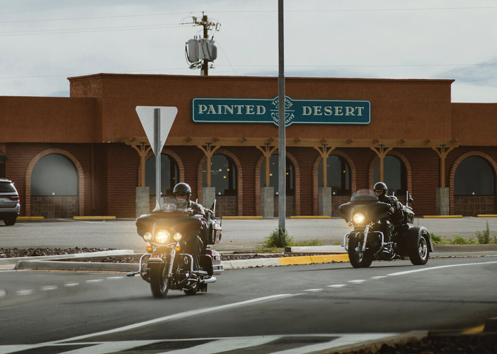 harley davidson motorcycle riders driving down the road